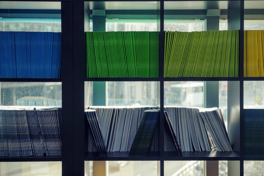 Colourful folders on office shelving