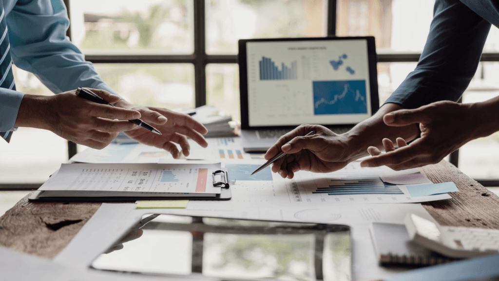 people working at a desk on program coordination activities